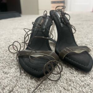 Good American Cinderella clear heel wedges.